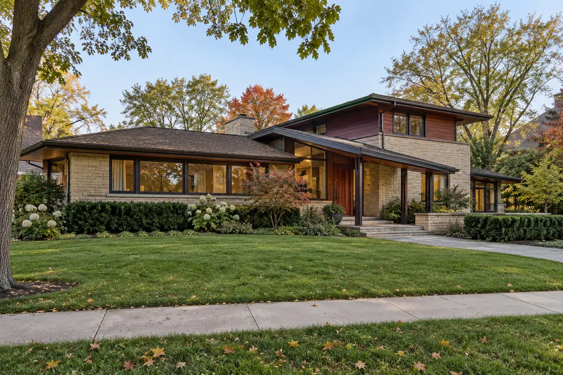Split-level home with tan brick and wide windows on a quiet street in the Fremd High School district of Palatine, IL