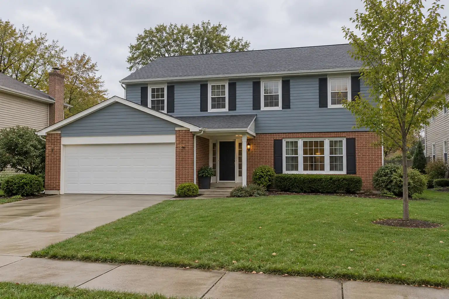 Two-story colonial home with an attached garage in Hunting Ridge, Palatine, IL