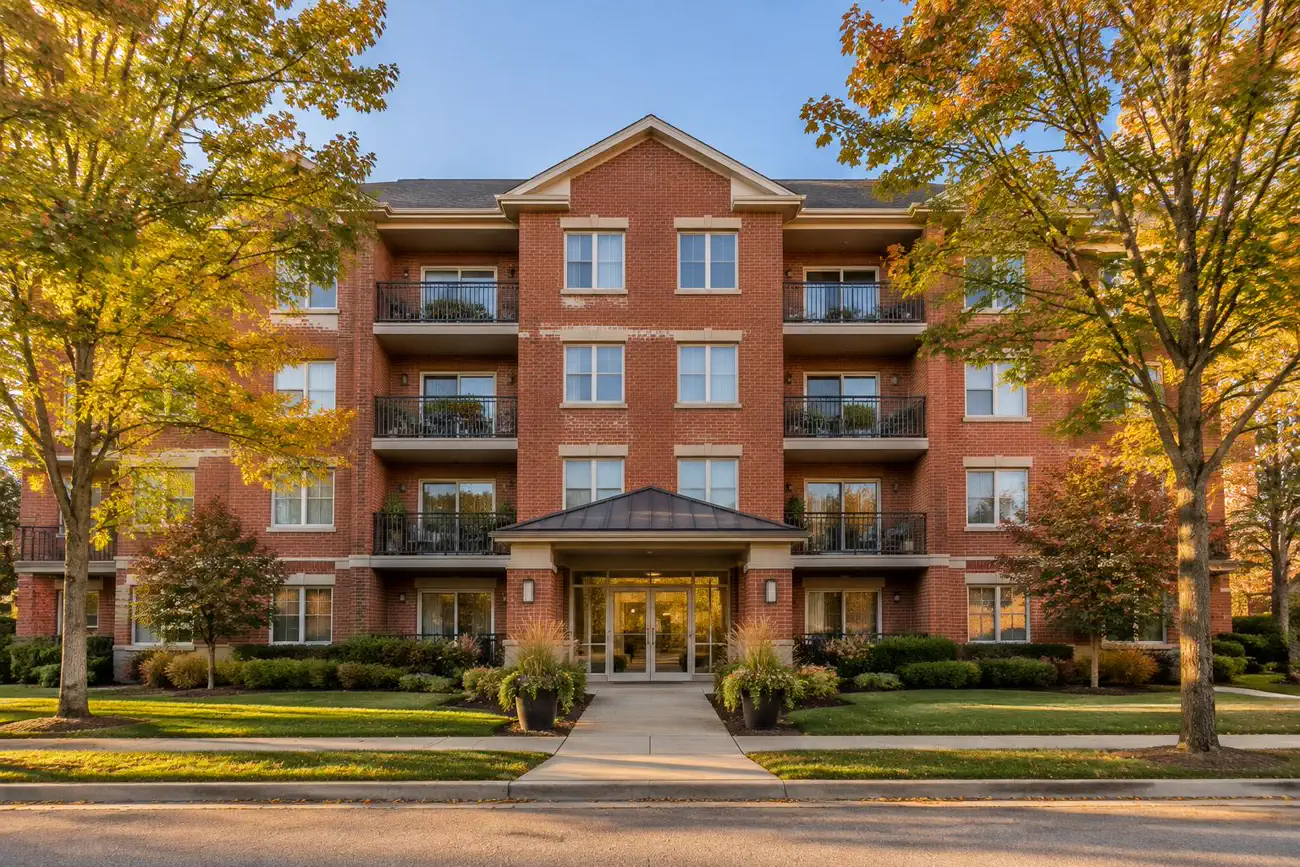 Brick and glass entrance of an elevator condo building in Palatine, IL