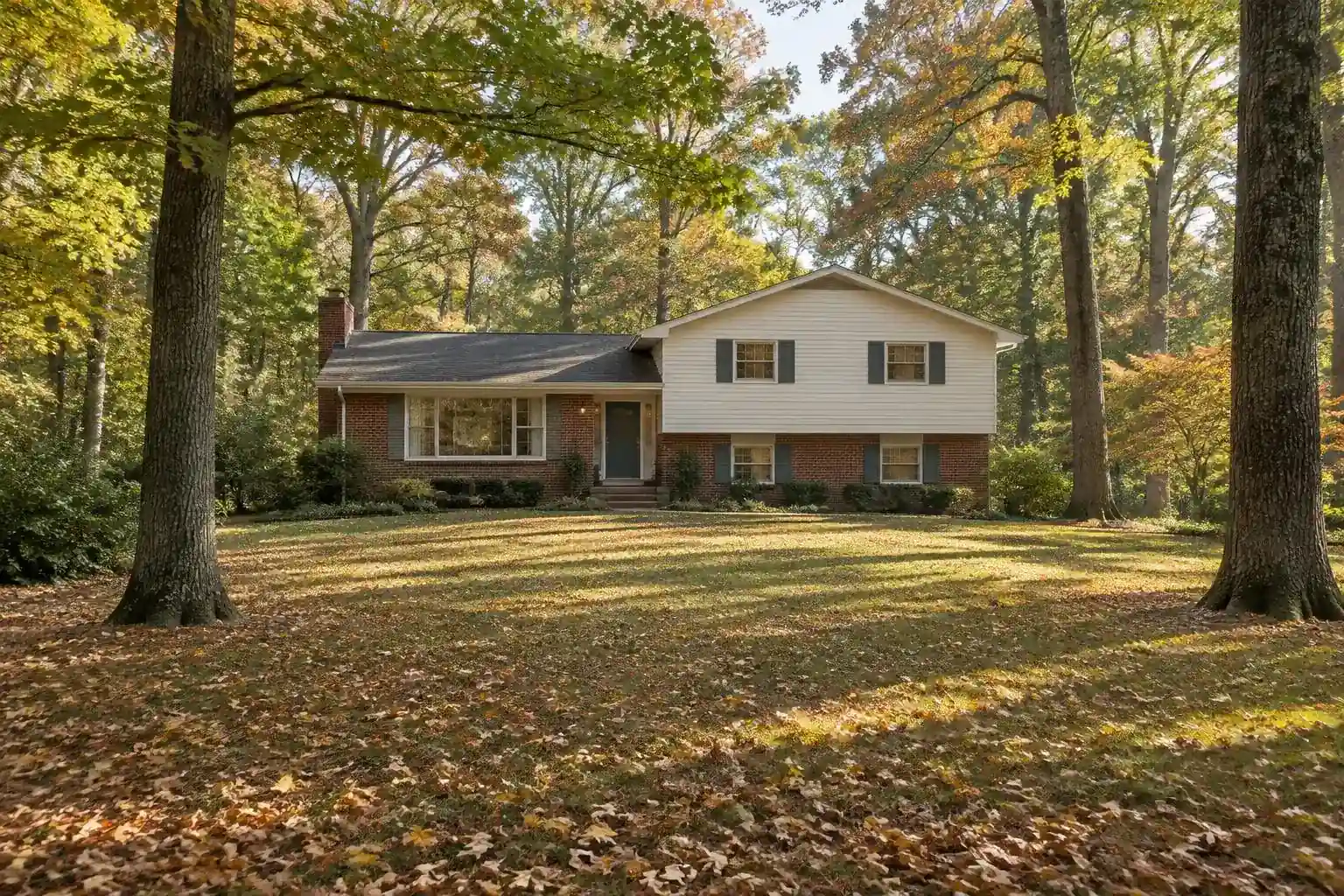 Split-level home with brick and siding on a wooded lot in Plum Grove Estates, Palatine, IL